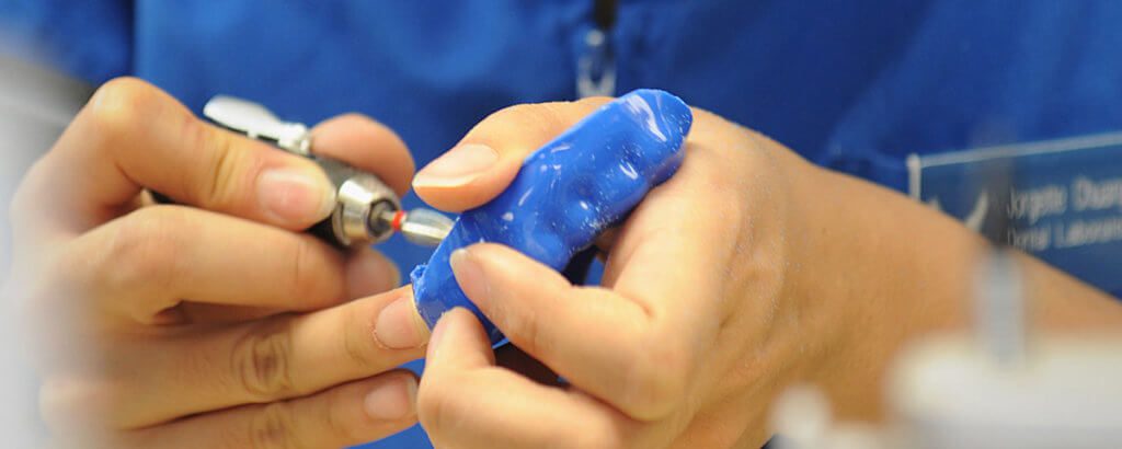 dentist working on mouthguard