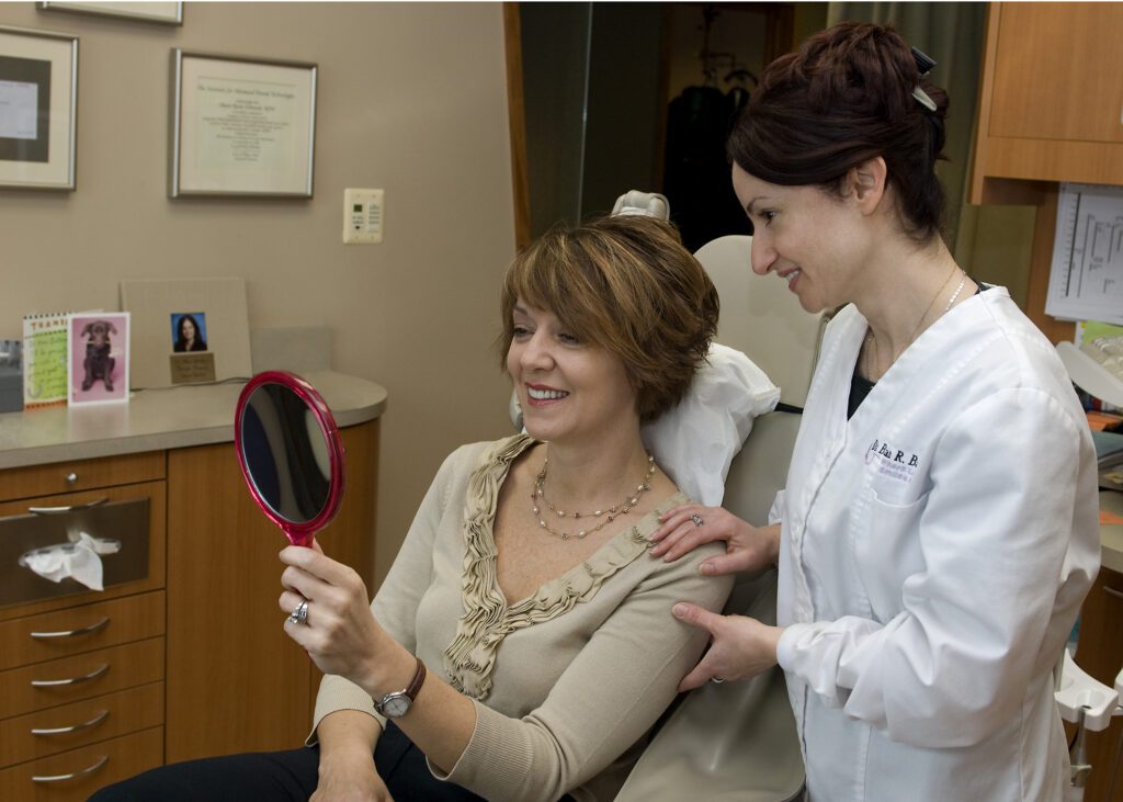 Dr. Barbat and client smiling